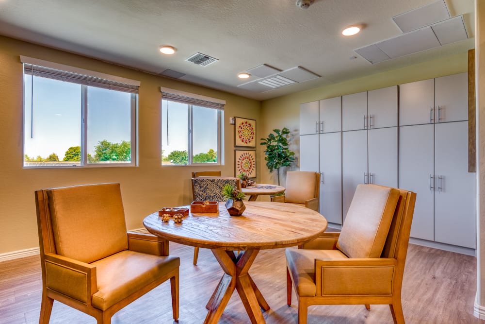 Seating area with round table at Pacifica Senior Living Paradise Valley in Phoenix, Arizona