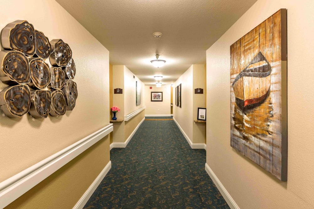 Well-lit hallway at Pacifica Senior Living San Leandro in San Leandro, California