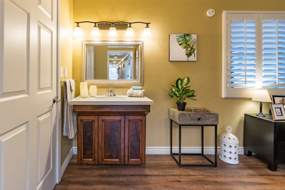 Mirror with vanity sink below it at Pacifica Senior Living Santa Barbara in Santa Barbara, California