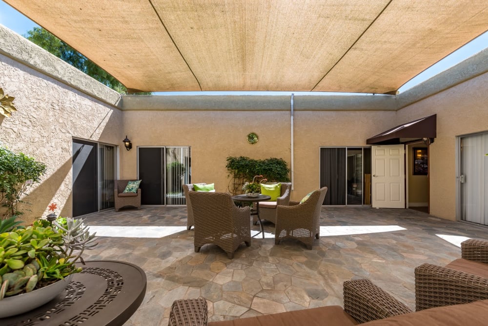 Covered outdoor seating at Pacifica Senior Living Santa Barbara in Santa Barbara, California