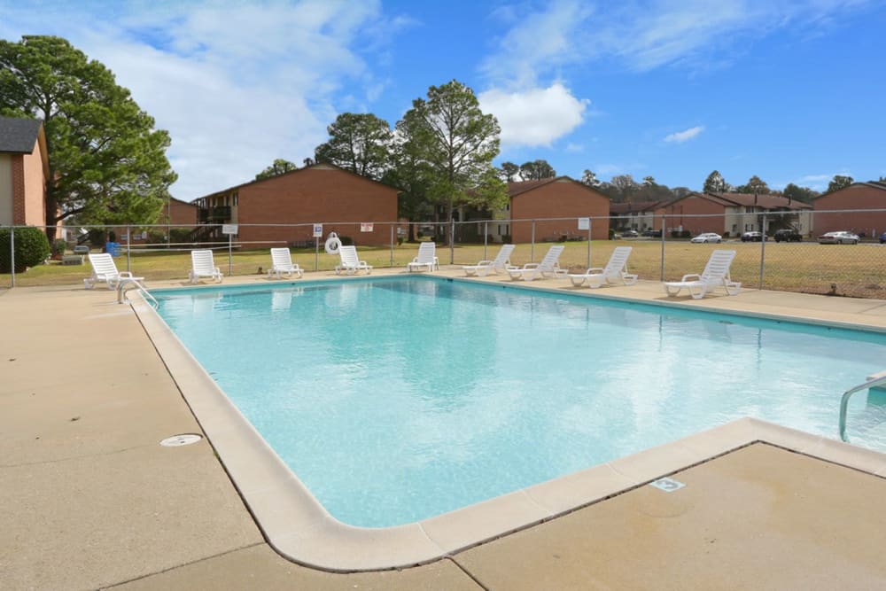 Swimming pool with nice lounge chairs at Eastdale Apartments in Montgomery, Alabama