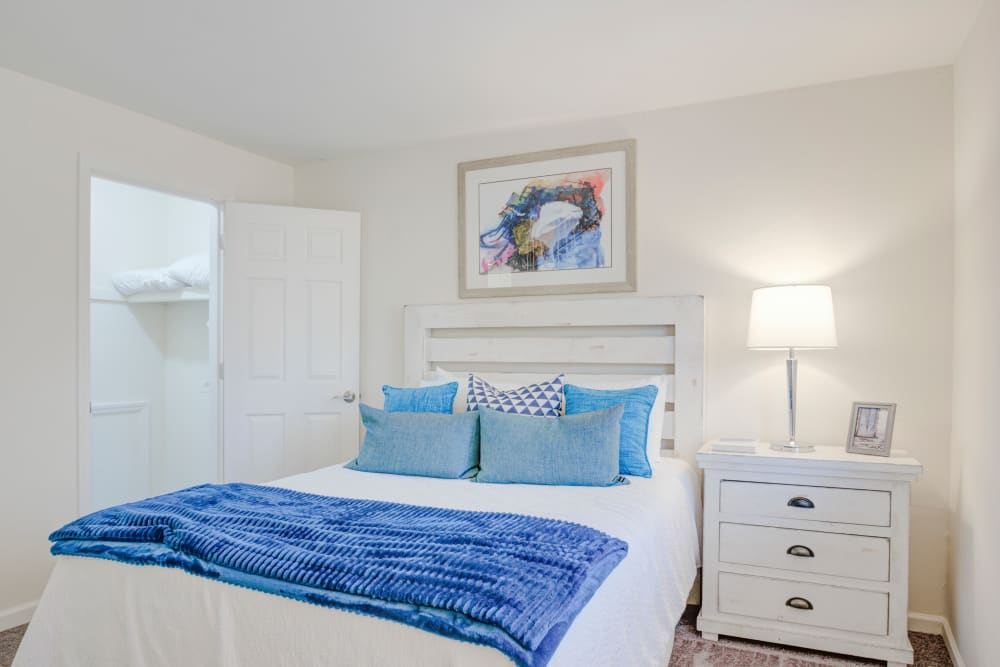 Bedroom with white furniture at The Village at Voorhees in Voorhees, New Jersey