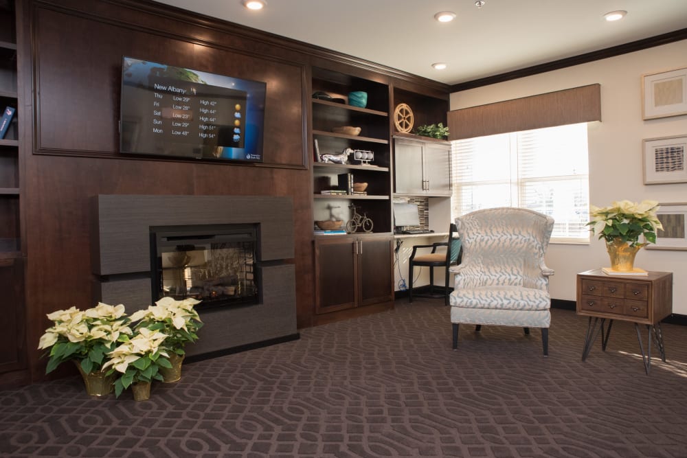 A community area with a fireplace at Liberty Station Health Campus in Liberty Township, Ohio