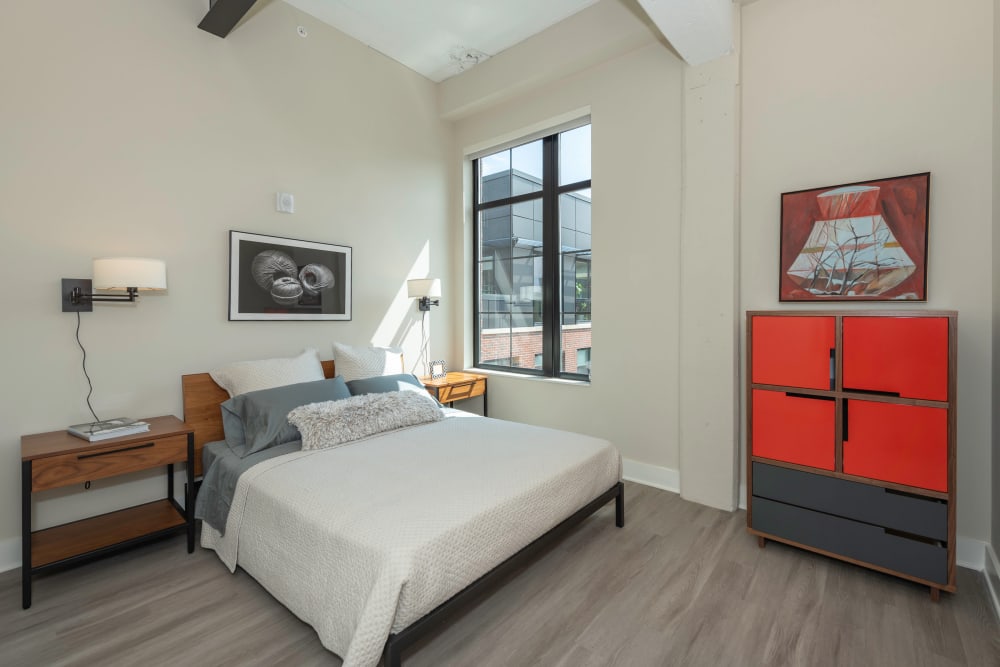 Model bedroom with plank flooring at Arcade Sunshine in Washington, District of Columbia