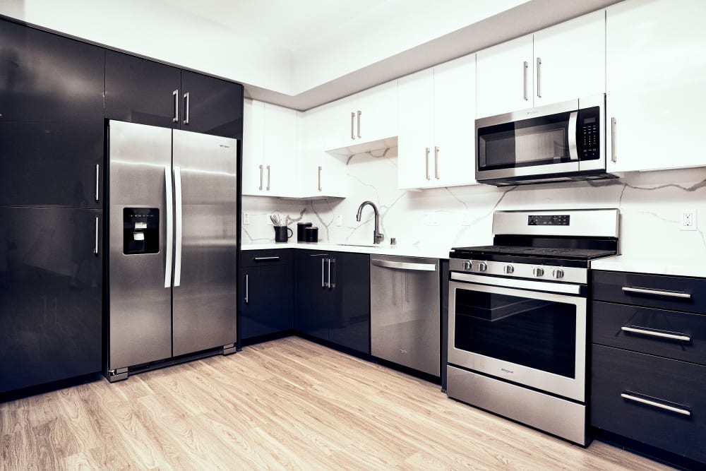 Kitchen with stainless-steel appliances at The Linden in Long Beach, California