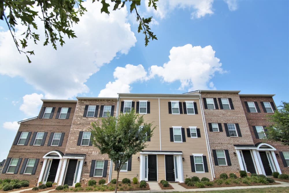 Modern brick buildings at Charleston Row Townhomes in Pineville, North Carolina
