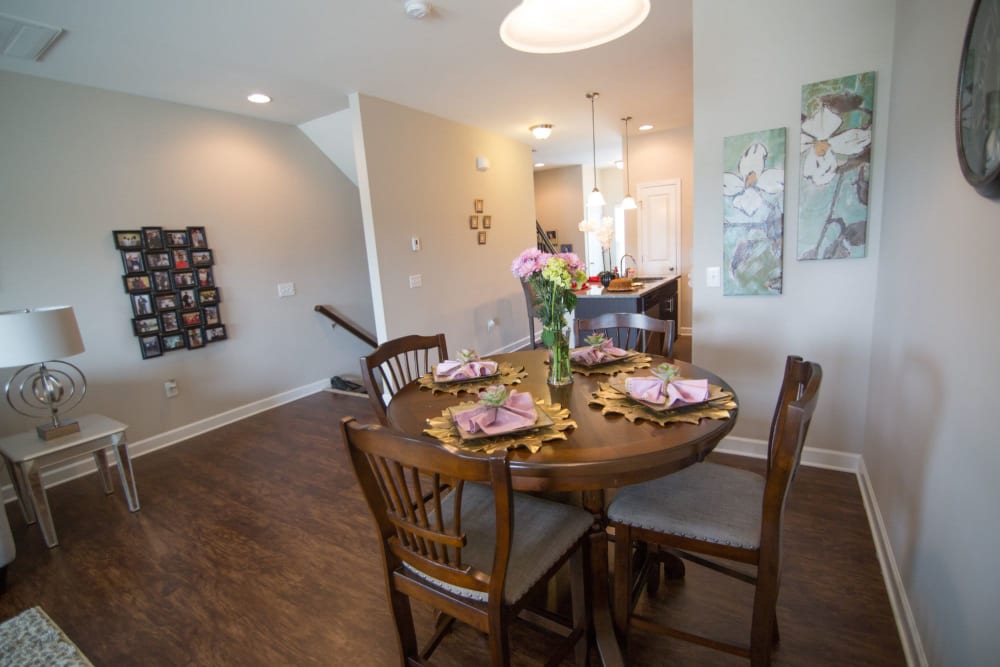 Living room with modern artistic features at Charleston Row Townhomes in Pineville, North Carolina
