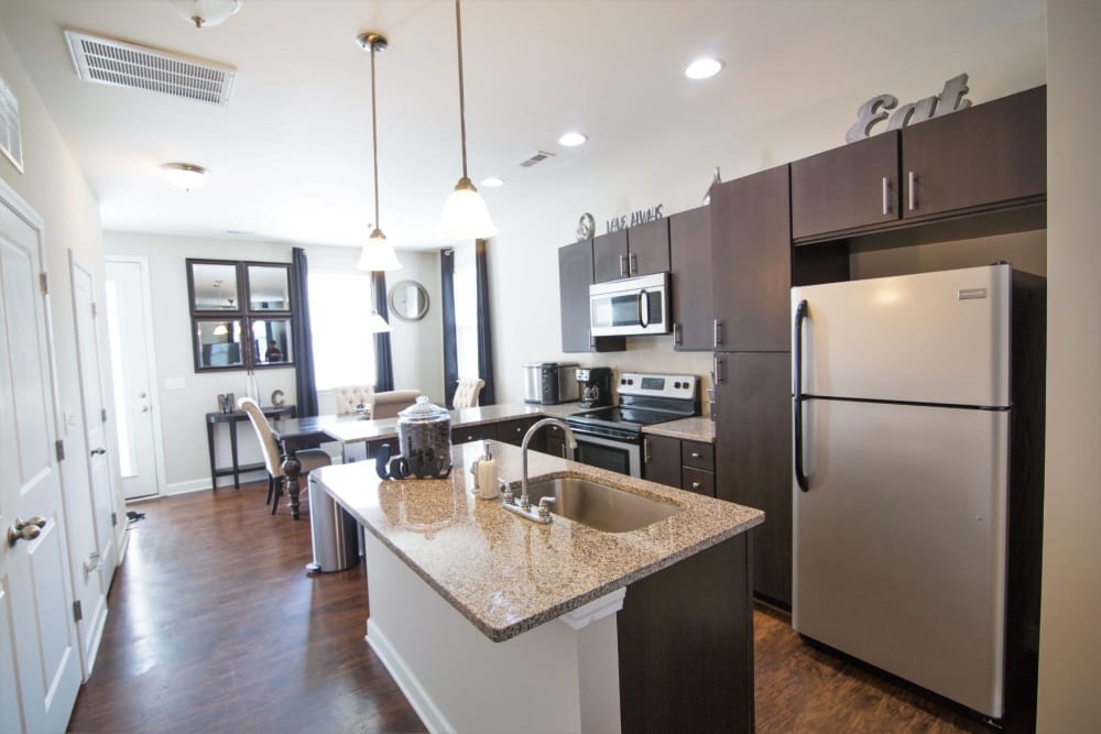 Kitchen area with stainless steel appliances at Charleston Row Townhomes in Pineville, North Carolina