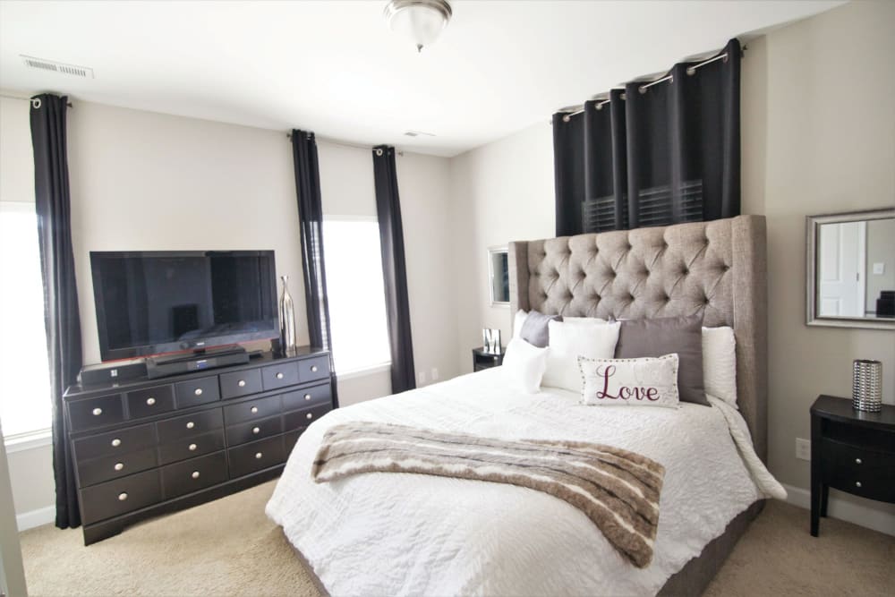 Bedroom with modern details at Charleston Row Townhomes in Pineville, North Carolina