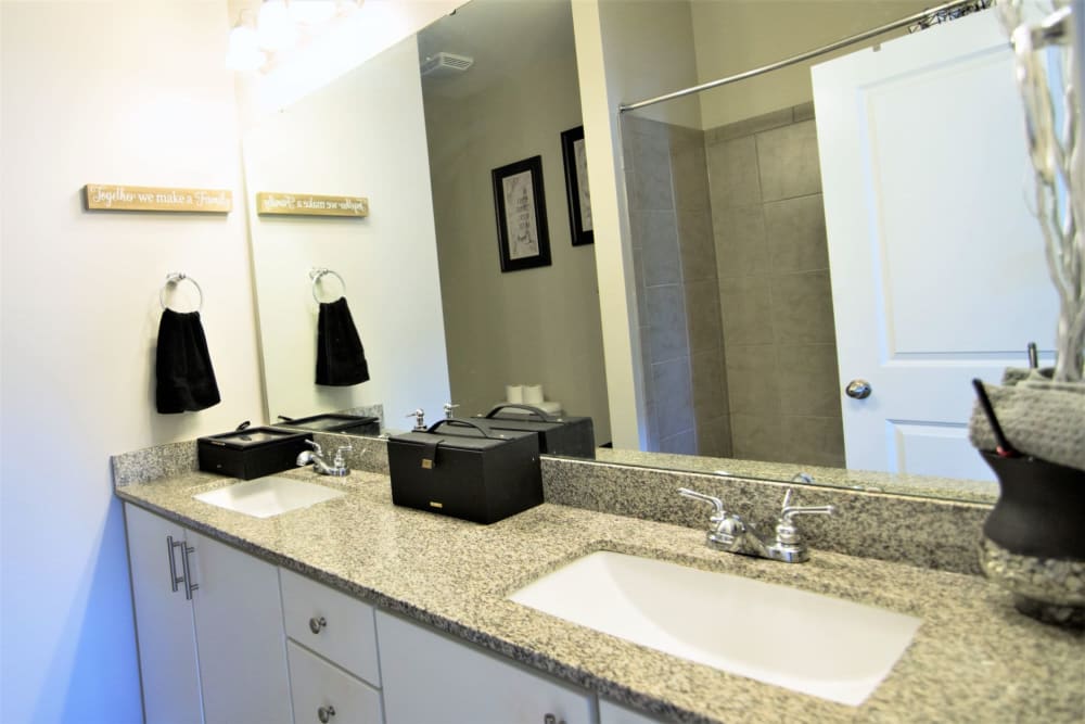 Bathroom with granite countertops at Charleston Row Townhomes in Pineville, North Carolina