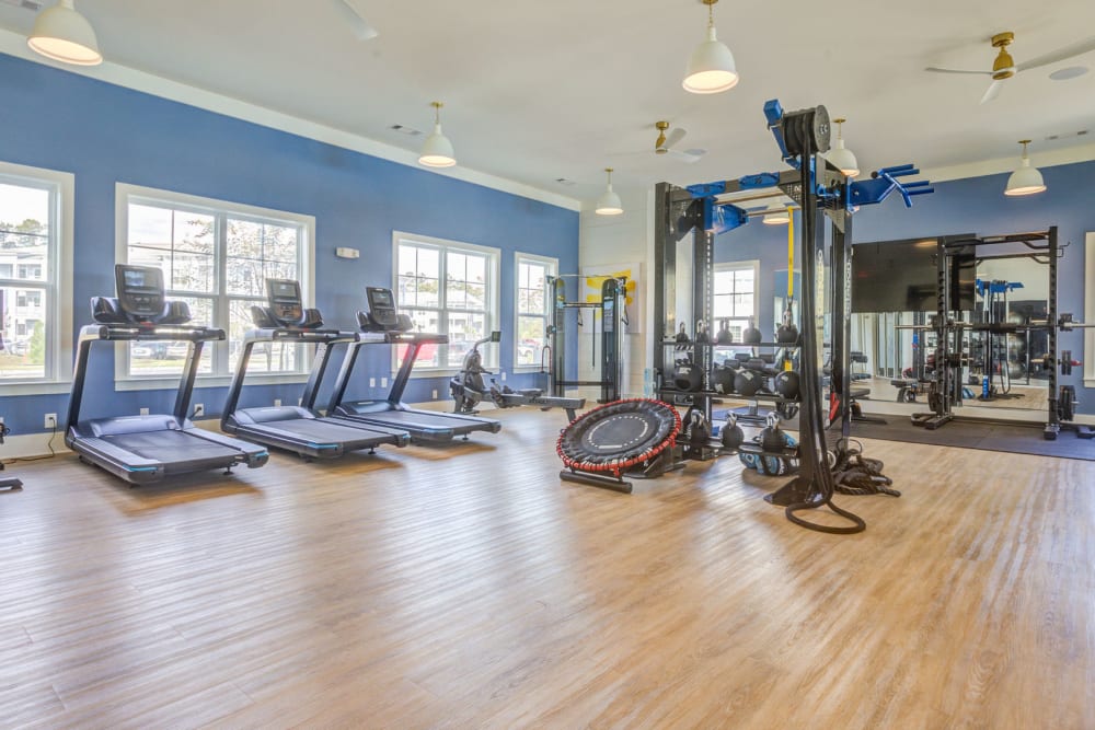 Open large fitness room with treadmills and free weights at The Hudson at Cane Bay in Summerville, South Carolina