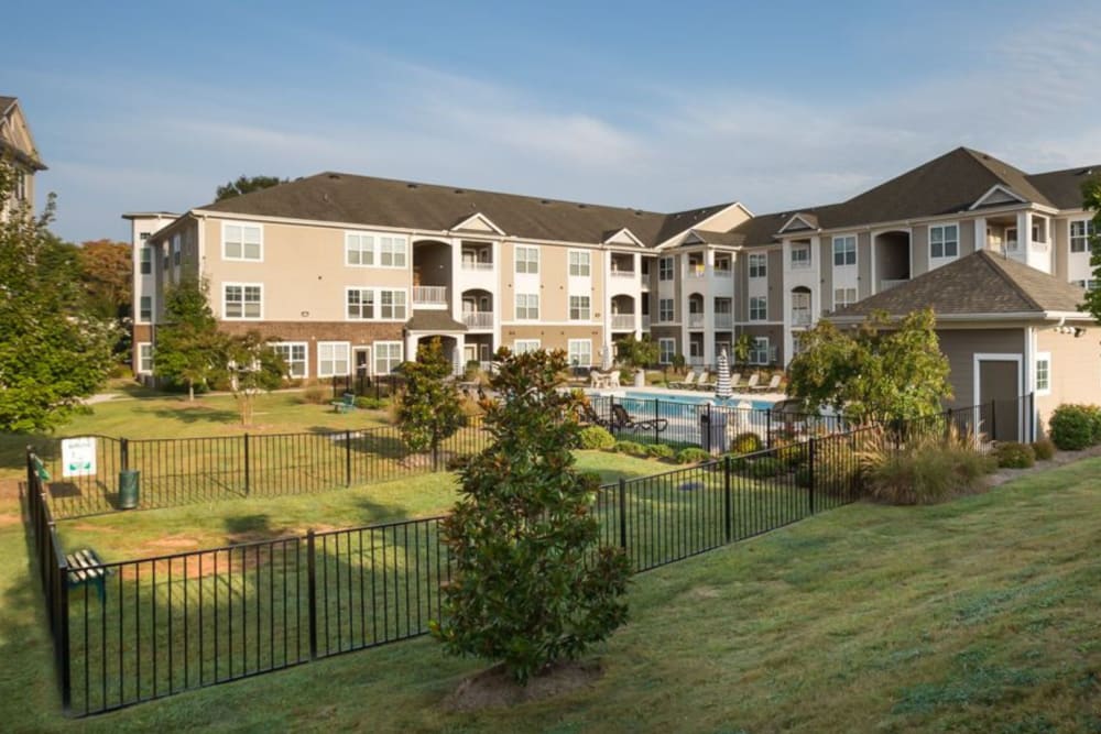 Apartment building with fenced pool and professional landscaping at 29 North in Hickory, North Carolina