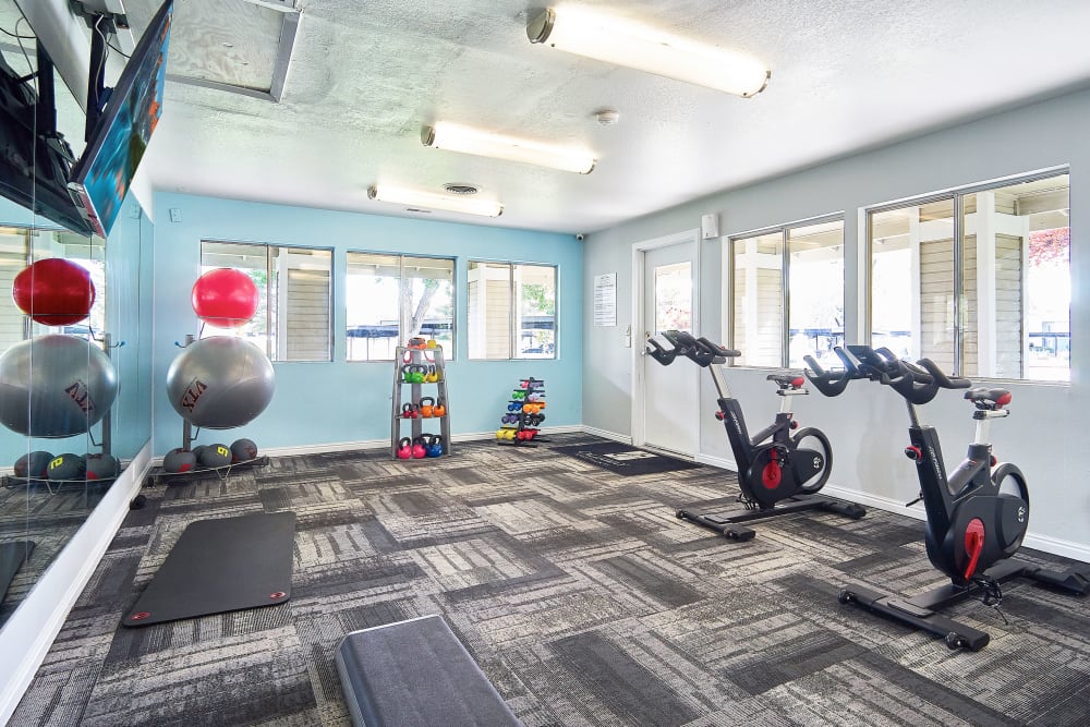 Fitness center with plenty of individual workout stations at Callaway Apartments in Taylorsville, Utah