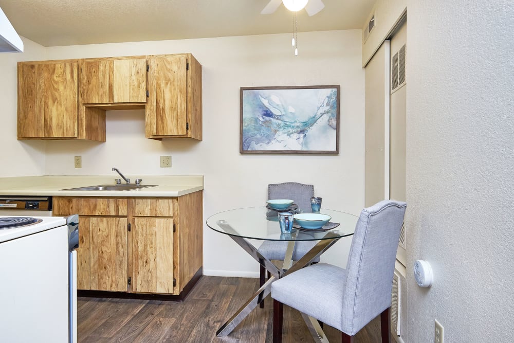 Dining room with wood-style flooring at Callaway Apartments in Taylorsville, Utah