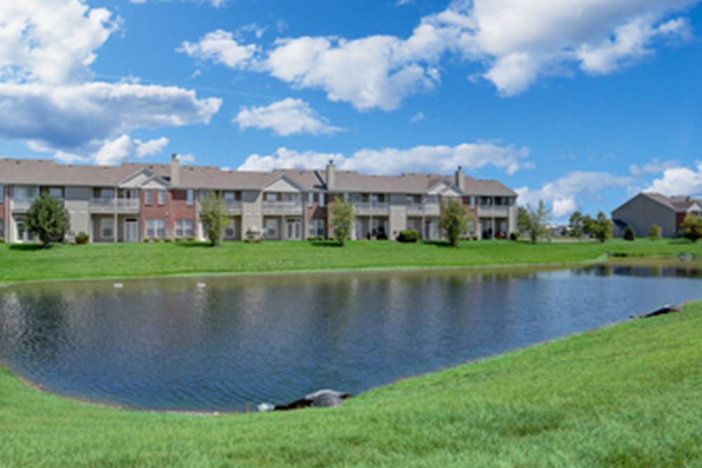 Exterior view of apartment building on the waters edge at Watersedge in Champaign, Illinois