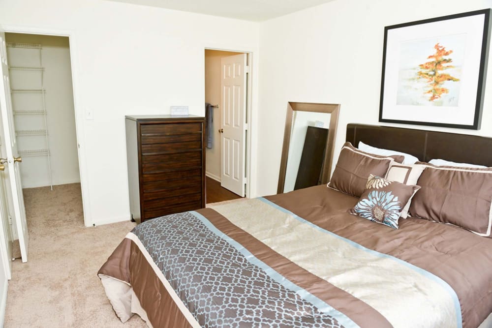 Resident bedroom with walk-in closet at Hunters Point in Zionsville, Indiana