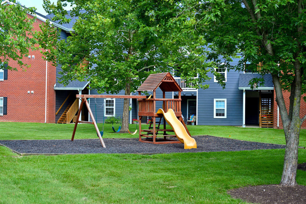 Resident child playground surrounded by grass at Hunters Point in Zionsville, Indiana