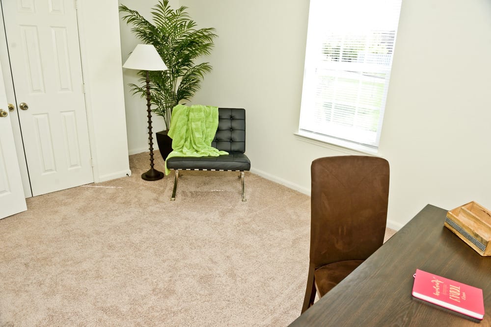Resident living space with plush carpeting at Hunters Point in Zionsville, Indiana