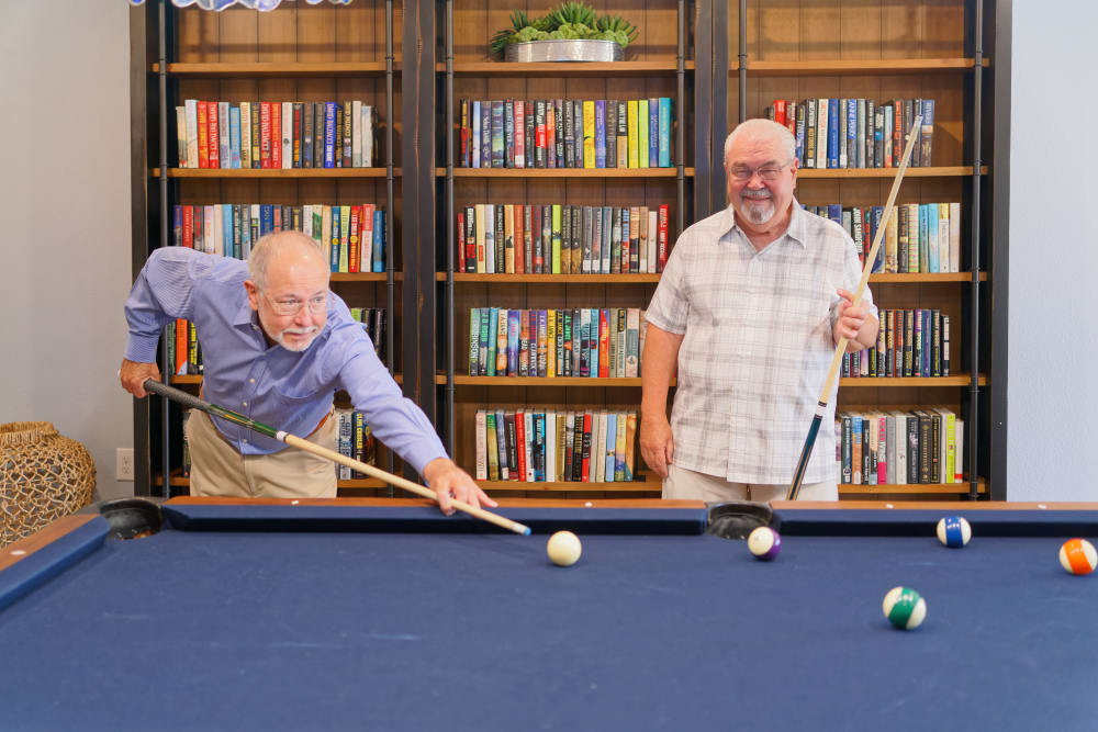 Residents playing a game of pool at Atlas Point at Prestonwood in Carrollton, Texas.