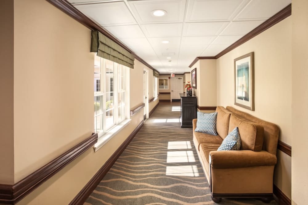 Hallway with seating at Pacifica Senior Living Spring Valley in Las Vegas, Nevada