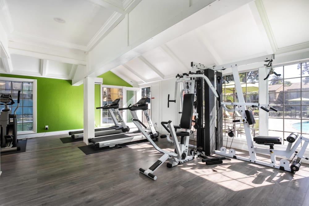 Big workout room full of modern equipment at Sierra Vista Apartments apartment homes in Redlands, California