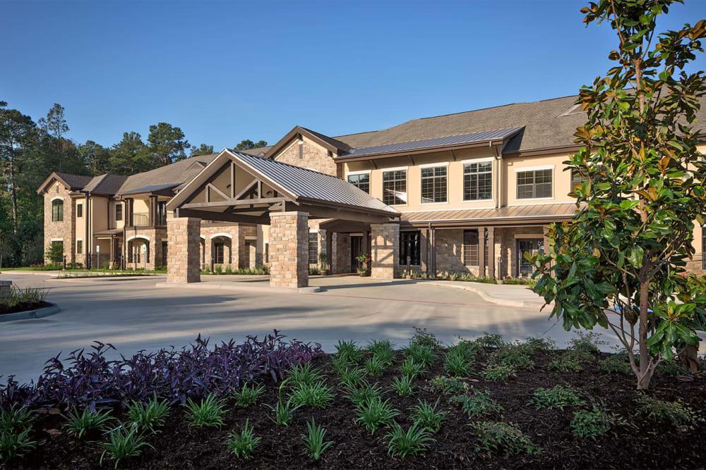 The driveway and building exterior of Spring Creek Village in Spring, Texas