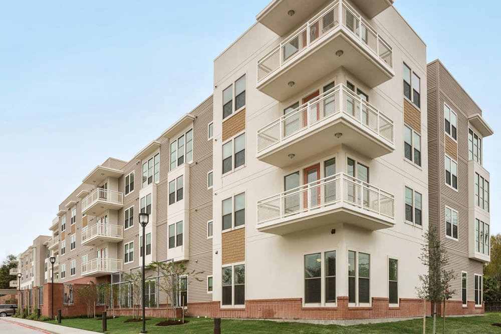 Apartment exterior and balconies at The Village of the Heights in Houston, Texas