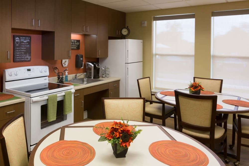 The community kitchen and dining room seating at The Village of the Heights in Houston, Texas