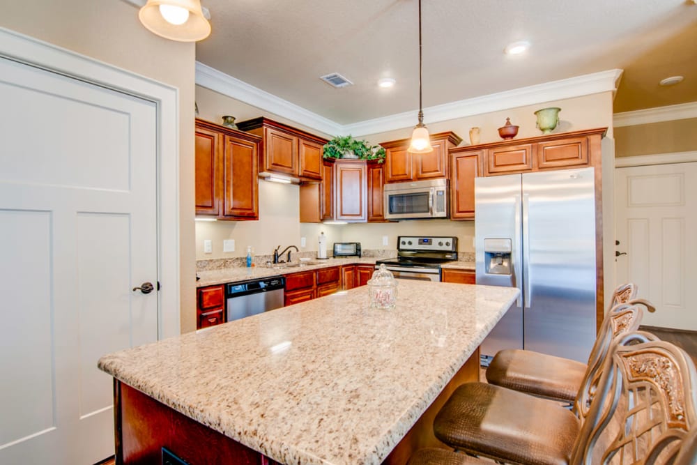 Granite counter tops in a cottage kitchen at Village on the Park Rogers in Rogers, Arkansas