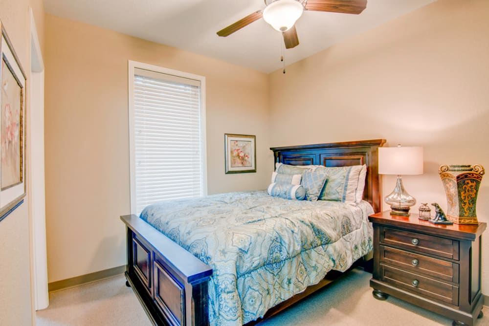 An apartment bedroom at Village on the Park Rogers in Rogers, Arkansas