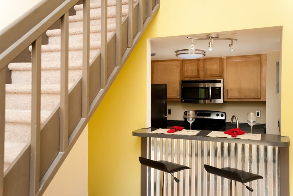 Staircase and kitchen at Crescent at Shadeland in Lexington, Kentucky