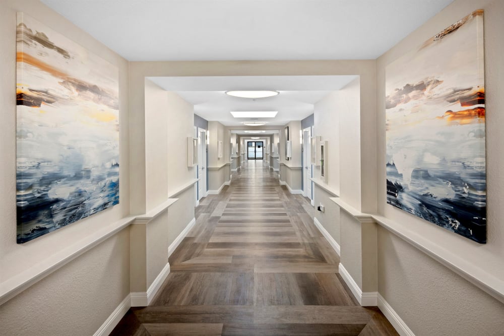 Interior hallway with wall art at Pacifica Senior Living Vista in Vista, California