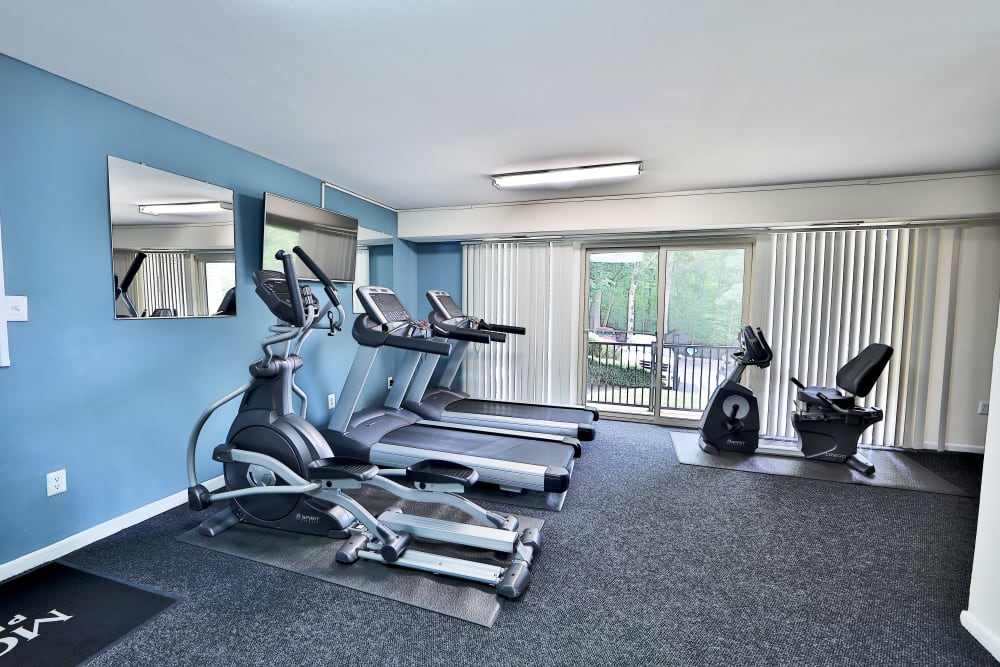 Well equipped fitness center with cardio equipment at Harbor Place Apartment Homes in Fort Washington, Maryland