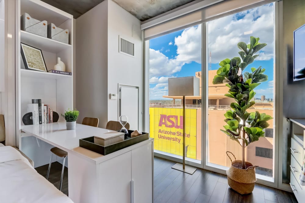 Home office setup with city views at Kenect Phoenix in Phoenix, Arizona