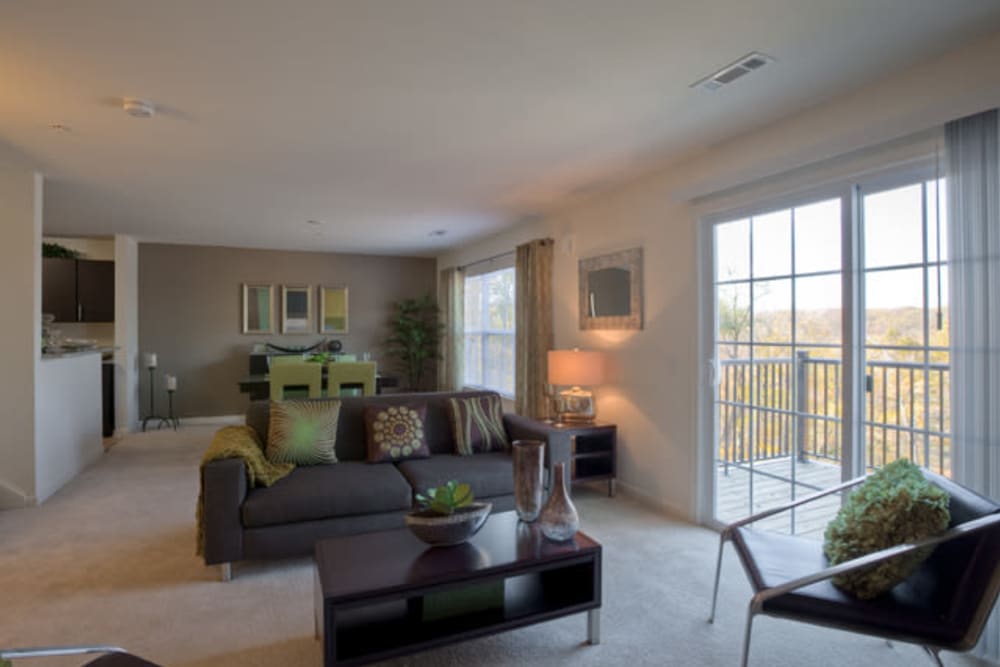 Townhome living and dining room with large windows at Vista at Town Green in Elmsford, New York