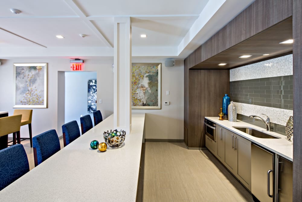 Resident lounge with kitchen at Vista at Town Green in Elmsford, New York