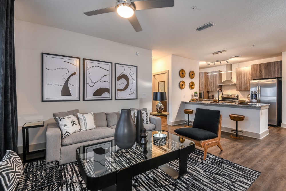Apartment living room with area rug, coffee table, and couch at Soba Apartments in Jacksonville, Florida