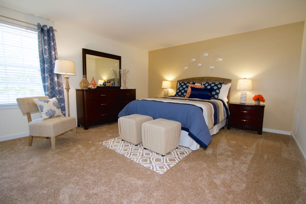 a furnished bedroom at Aspen Apartments in Virginia Beach, Virginia