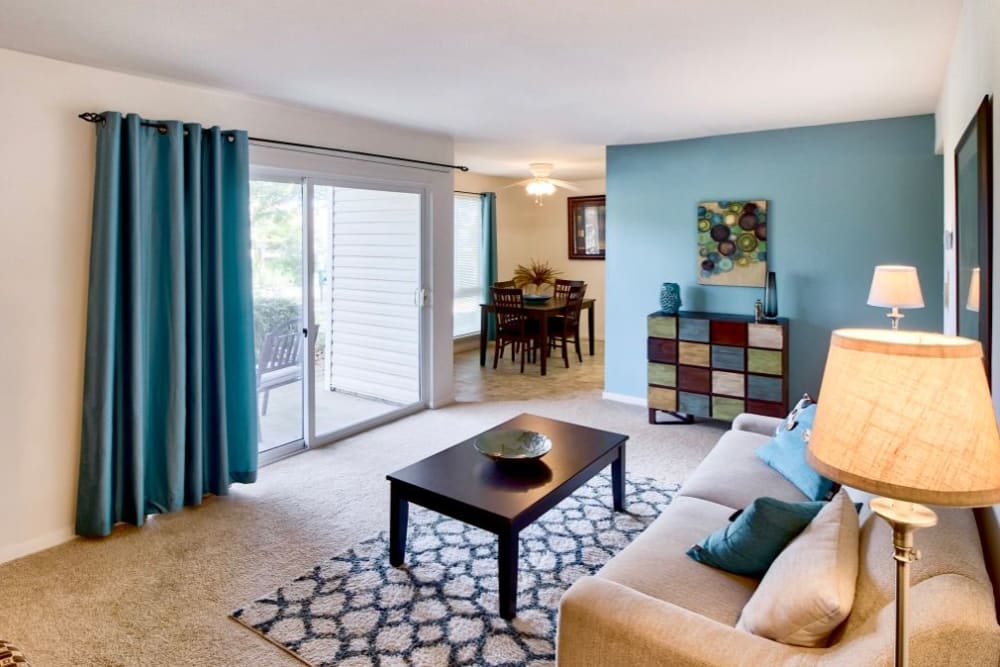 living area with blue walls at Brookside Village Apartments in Virginia Beach, Virginia