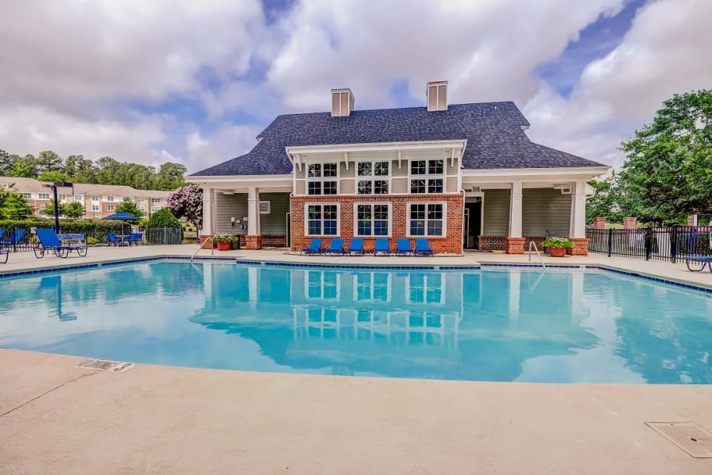 Beautiful blue sky with a luxurious pool Heather Park Apartment Homes in Garner, North Carolina