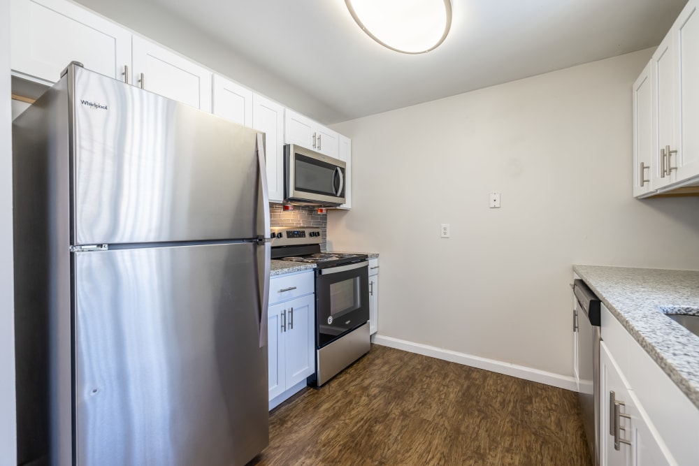 Fully equipped kitchen with stainless steel appliances at Long Pond Gardens Senior Apartments in Rochester, New York
