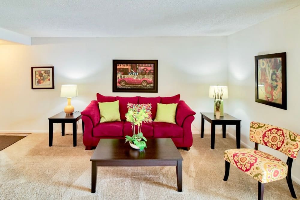 a cozy red couch at South Lake Apartments in Virginia Beach, Virginia