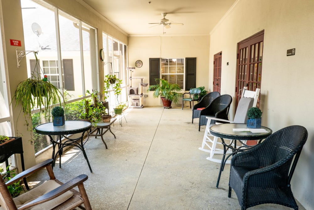 Screened in porch with comfortable seating at The Club at Lake Wales in Lake Wales, Florida