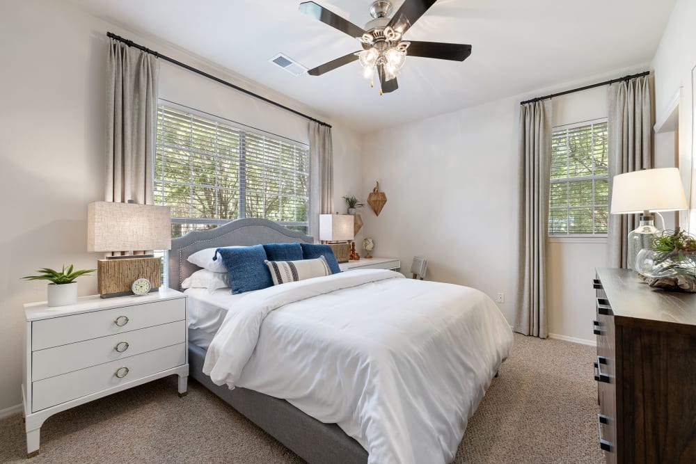 Large carpeted bedroom with walk in closet at Marquis of Carmel Valley in Charlotte, North Carolina