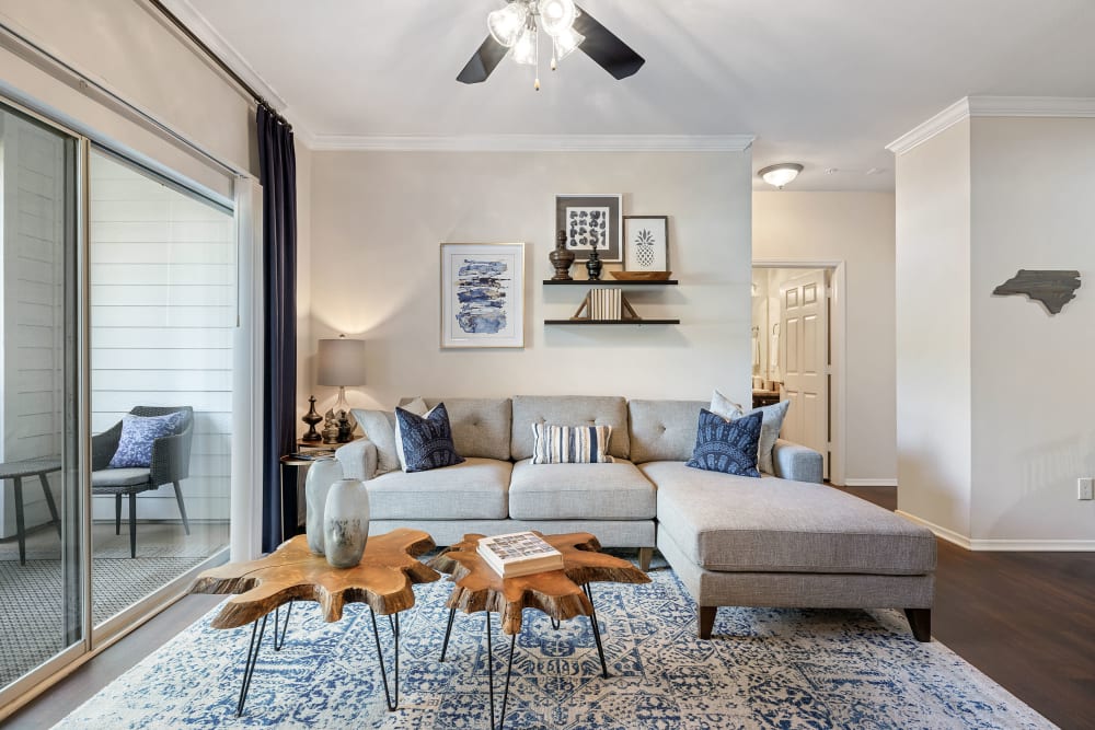Spacious and modern style living room with entertainment center nook at Marquis of Carmel Valley in Charlotte, North Carolina