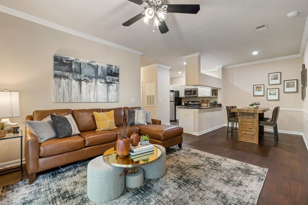 Spacious and bright living area with wood flooring at Marquis at Carmel Commons in Charlotte, North Carolina