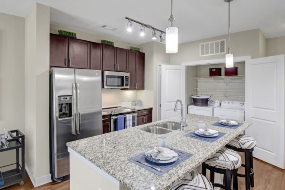 Gourmet kitchen with a large island and in-home washer and dryer at Artessa in Franklin, Tennessee