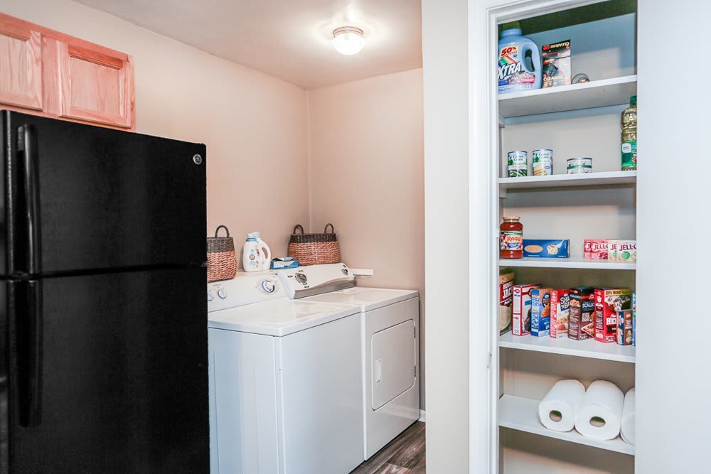 Apartment kitchen, pantry, and laundry room at Cedar Point in Roanoke, Virginia