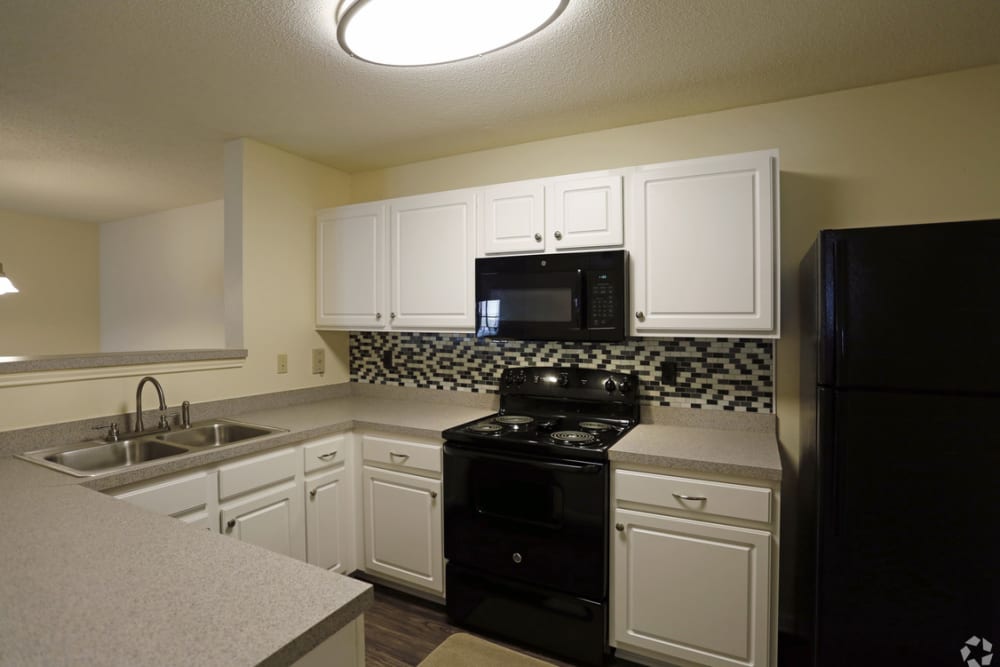 Apartment kitchen at Camellia Trace in Jackson, Tennessee
