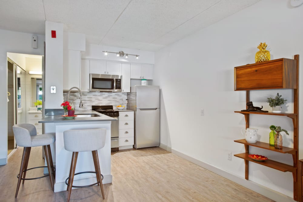 Model kitchen leading into living space at Capri On Camelback in Phoenix, Arizona